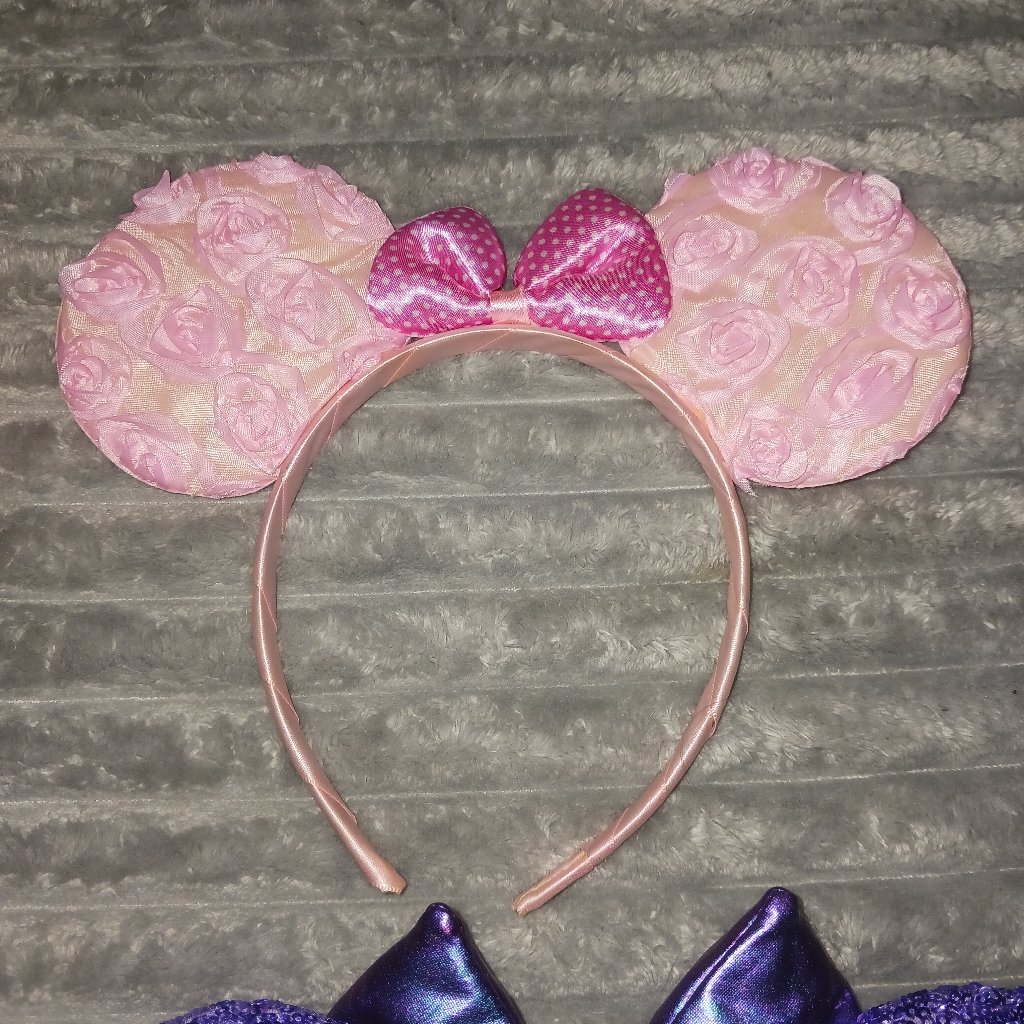 A red sequin Minnie Mouse ears headband photographed for a US resale marketplace listing in September 2026
